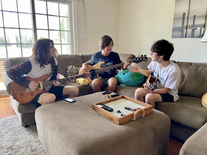 Bandmates (l-r) Zach Yenovkian, Alex Boswell and Oliver Sachs play a sample of the album’s first single, “Massachusetts.” ELLEN DRISCOLL PHOTO
